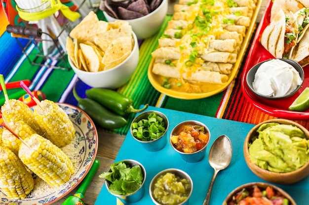 Fiesta party buffet table with traditional Mexican food.