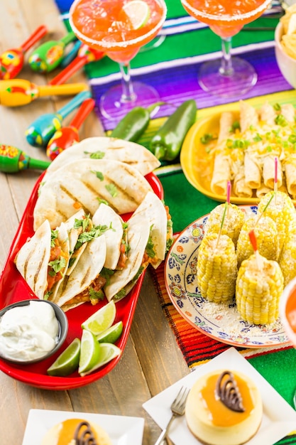 Fiesta party buffet table with traditional Mexican food.