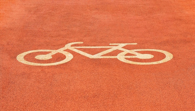 Fietsteken bij rode fietspad of wegachtergrond