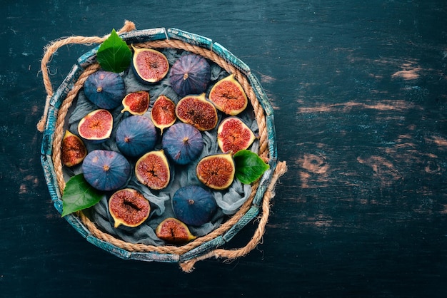 Fig Fresh fruit figs in a wooden box Free space for text Top view