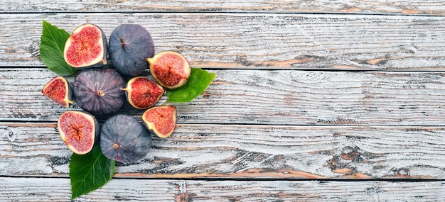 Fig Fresh fruits of figs on a white wooden table Free space for text Top view