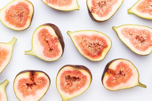 Fig fruits isolated on white background. Top view. Flat lay pattern