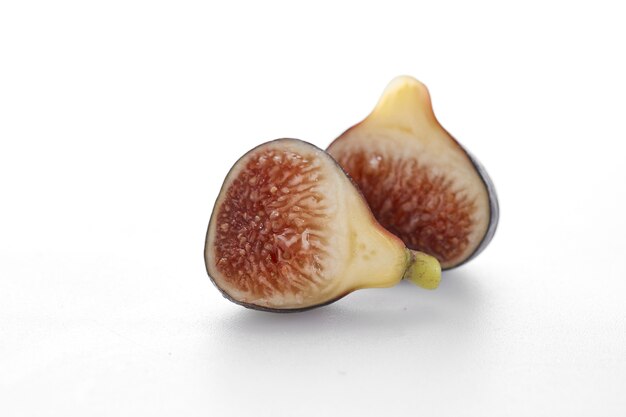 Fig fruits with leaves on white