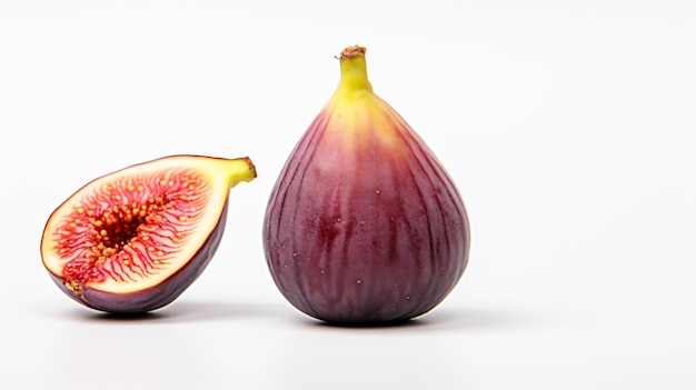 Photo a fig and a half cut fig on a white surface