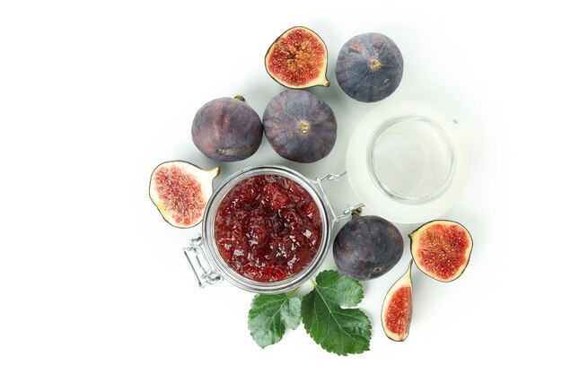 Fig jam and ingredients isolated on white background