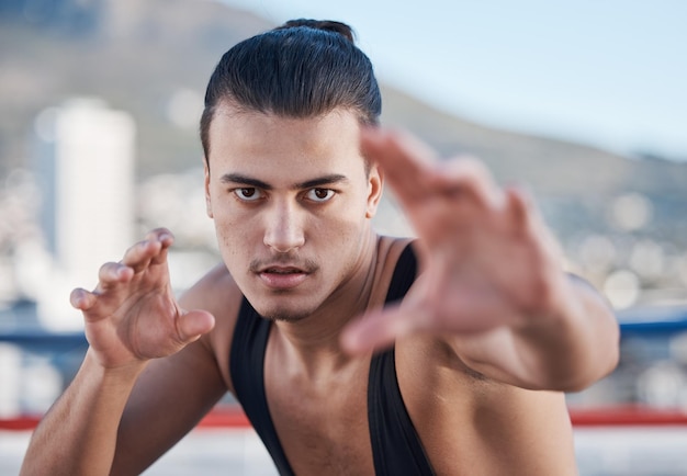 Fight portrait and a man doing karate in the city training for taekwondo or sports competition Serious fitness and a professional athlete with a move for a workout or martial arts exercise