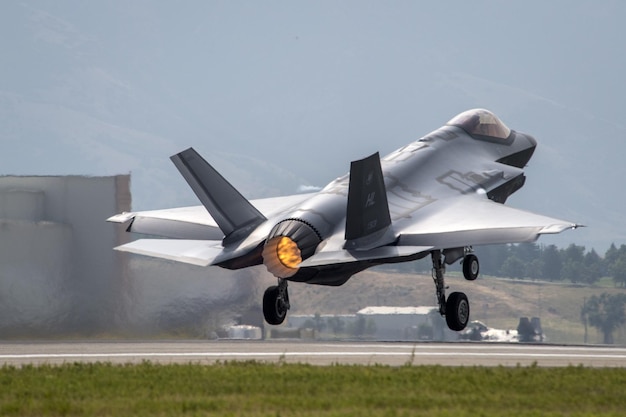 A fighter jet takes off from the runway.