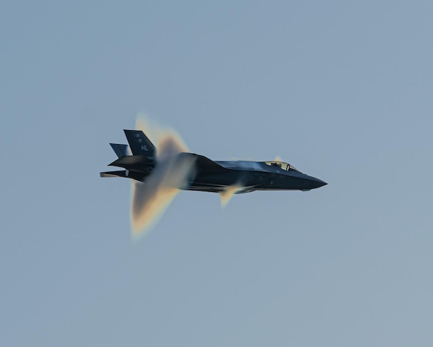 A fighter jet with the word f - 16 on the tail