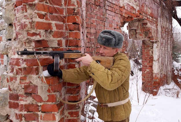 Fighter of Red army with the PPSh machine gun in ruins of Stalingrad a staff of a division of Lyudnikov