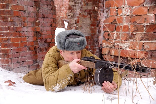 Fighter of Red army with the PPSh machine gun in ruins of Stalingrad a staff of a division of Lyudnikov