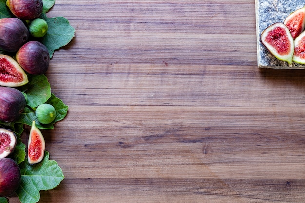 Figs on rustic wooden background