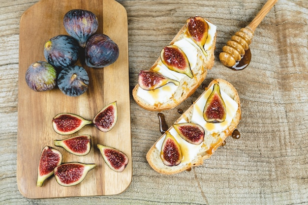 Figs with fresh cheese on toast Copy space.