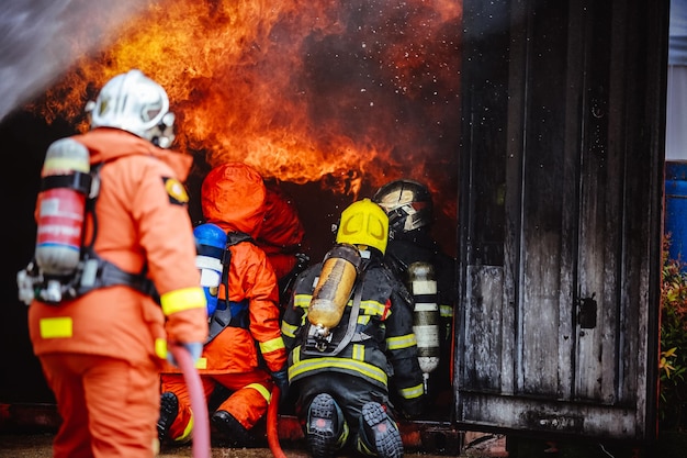 figters against fire in container