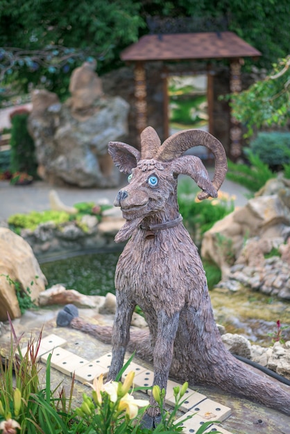 The figure of a goat with bare eyes from a cartoon in the Park. close up