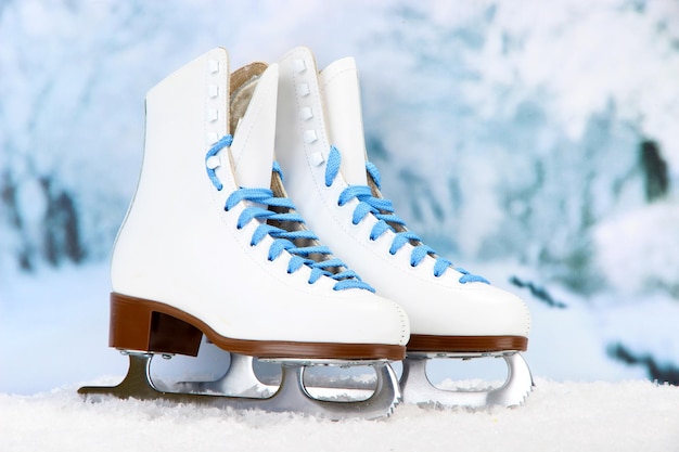 figure skates on winter background