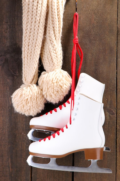 Figure skates on wooden background