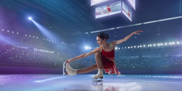 Figure skating girl in ice arena