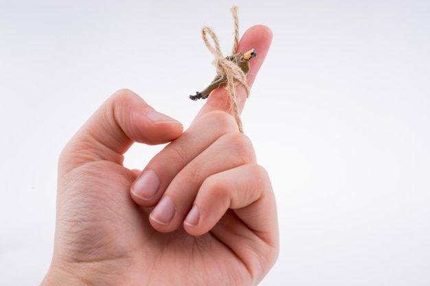 Photo figure tied to finger