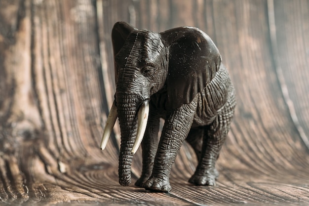 Figure of a toy elephant on a wooden 