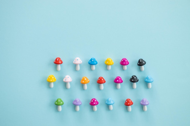 Figures in the form of colored mushrooms on a blue background