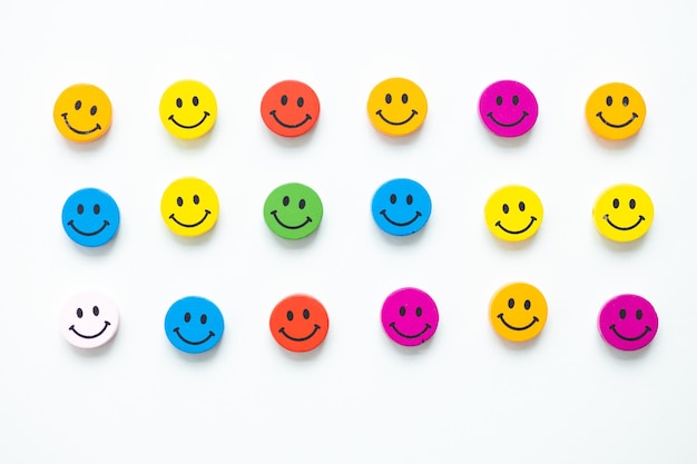 Figures in the form of colored smiles on a white background