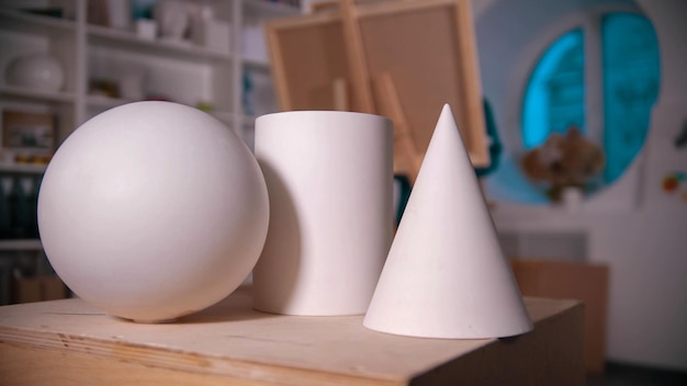 Figures standing on the table in the art studio