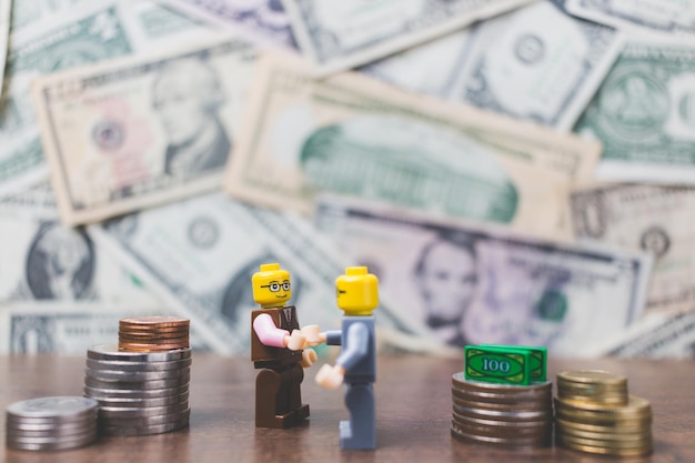 Photo figurines with currency on table