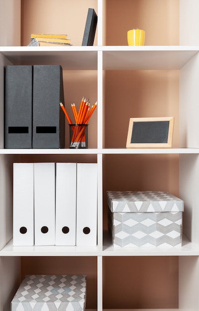 Photo file folders, standing on the shelves at office