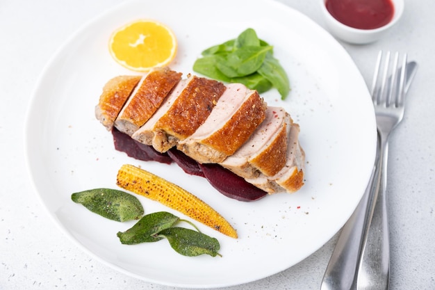 Files of the breast duck grill with beets mini corn and spinach fried sage orange and lingonberry sauce Traditional Mediterranean cuisine Selective focus closeup
