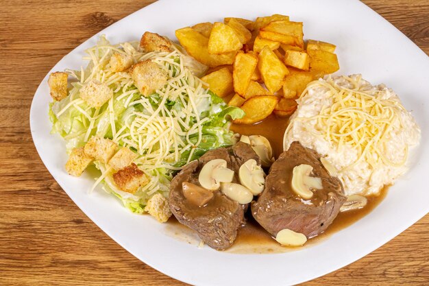 Filet with sauteed potatoes piamontese rice and caesar salad