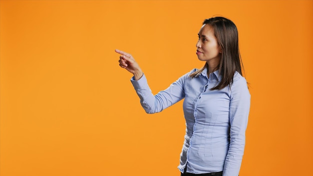 Filipino person checking holographic projection in studio