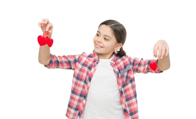 Fill heart with love. love and people concept small girl valentines day decoration. little present for her valentine. kid having fun while prepare for party. Sweet girl with red heart.