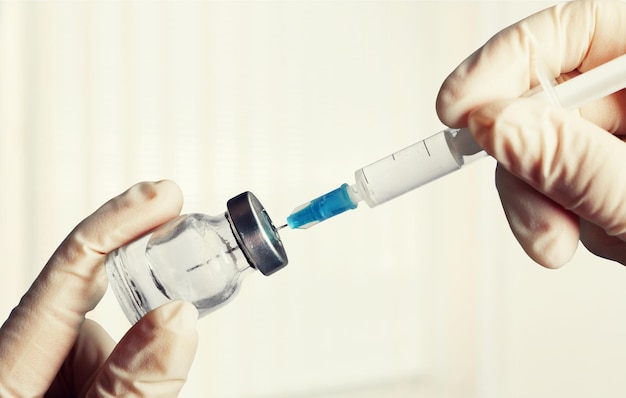 Filled syringe in vial