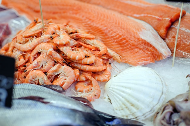 Fillet fresh uncooked seafood salmon and shrimps