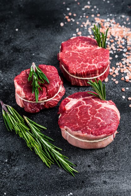 Fillet Mignon tenderloin raw meat beef steaks on butchery table