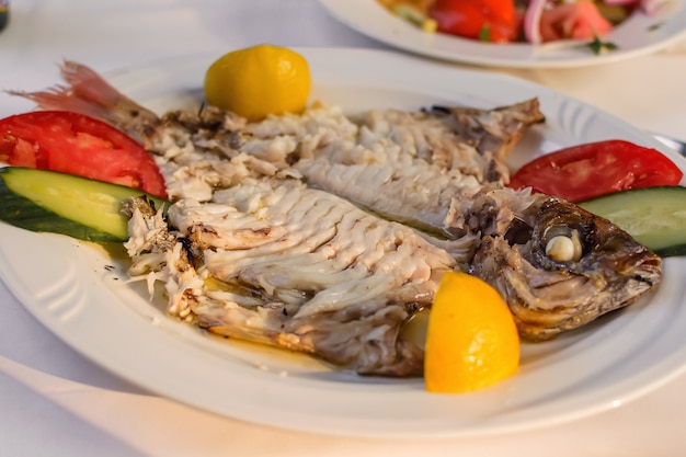 Filleted Common dentex fish on a plate -  Pink dentex, Dentex dentex, Dentex gibbosus,Red snapper