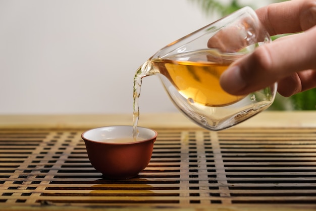 Filling the bowl with Chinese tea.