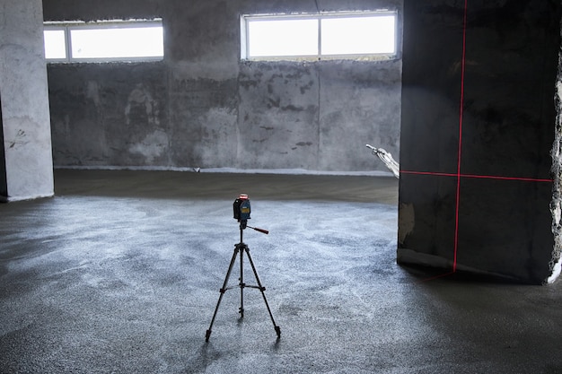 Filling the floor with concrete, screed and leveling the floor. Smooth floors made of a mixture of cement, industrial concreting