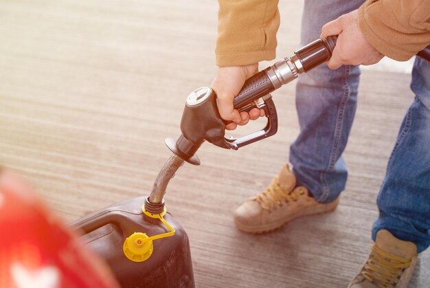 Filling the jerry can with fuel at a petrol station as the fuel crisis continues