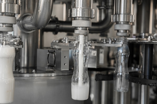 Filling milk in to plastic bottles at the factory. equipment at the dairy plant