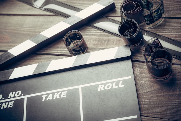 Photo film clipper and films on wooden table