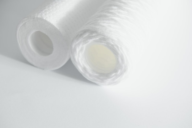 Filter cartridges for water on a white background Installation of reverse osmosis water purification system