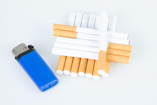 Photo filter cigarette stack in pyramid with blue lighter isolated on white