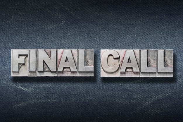 Final call phrase made from metallic letterpress on dark jeans background