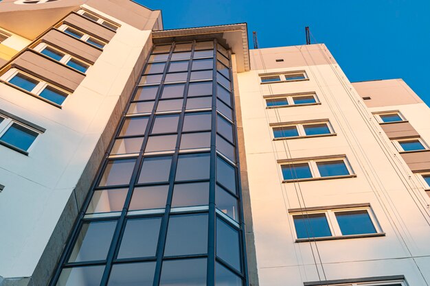 Final construction work on the facade of a new multi-storey residential building. Commissioning of a construction site.