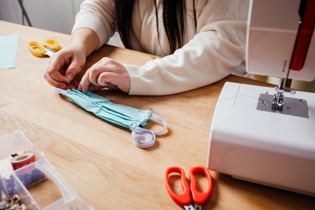 The final stage of medical mask sewing