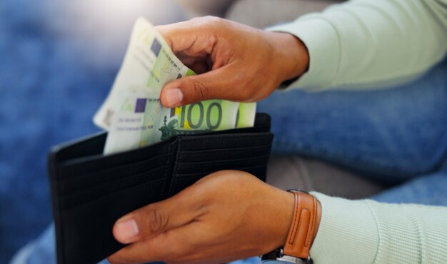 Finance cash and wallet with hands of man for payment banking and investment in living room currency bills and wealth with guy and counting euro money at home for purchase shopping and income