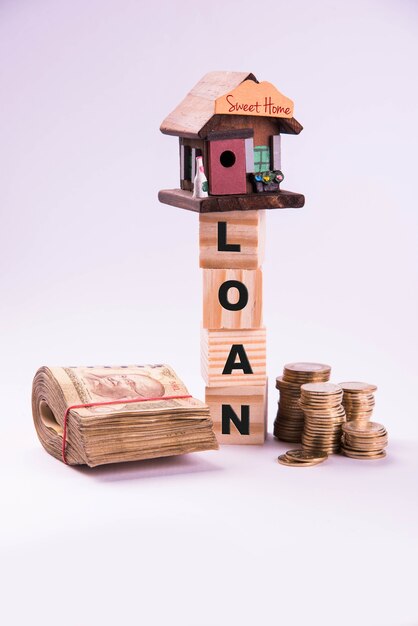 Finance and Housing Loan or purchase in India -  Concept showing 3D house model, indian currency notes and calculator etc