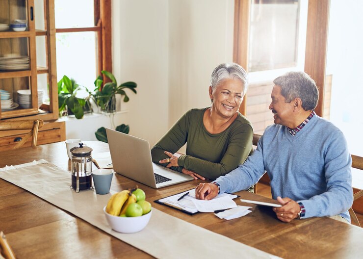 Photo finance laptop and happy senior couple with bills paperwork and documents for life insurance retirement pension and elderly man and woman on computer for mortgage payment investment and budget