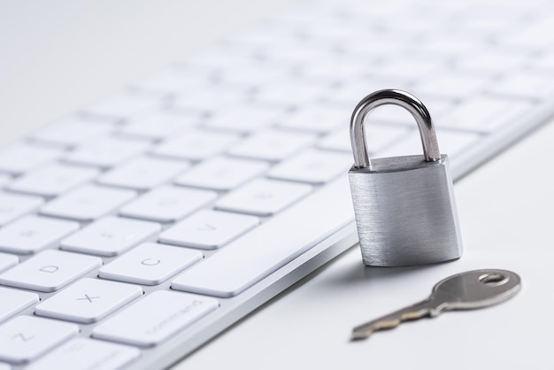 Finance security bank card with lock and key on a white table\
data security